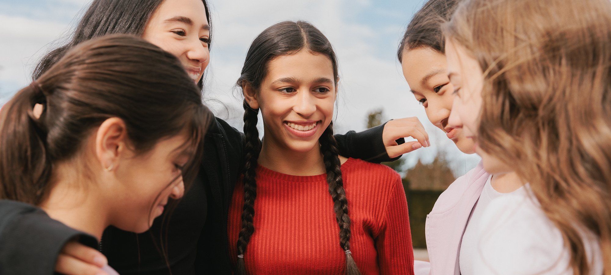 Group of girls laughing together.